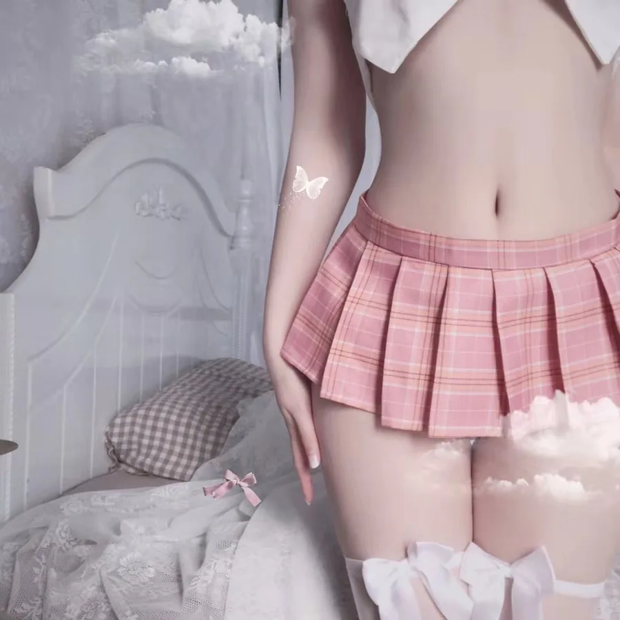 Mini-jupe plissée à carreaux avec culotte à pompons