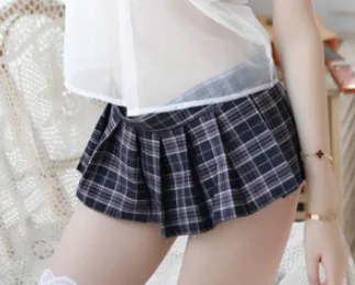 Mini-jupe plissée à carreaux avec culotte à pompons